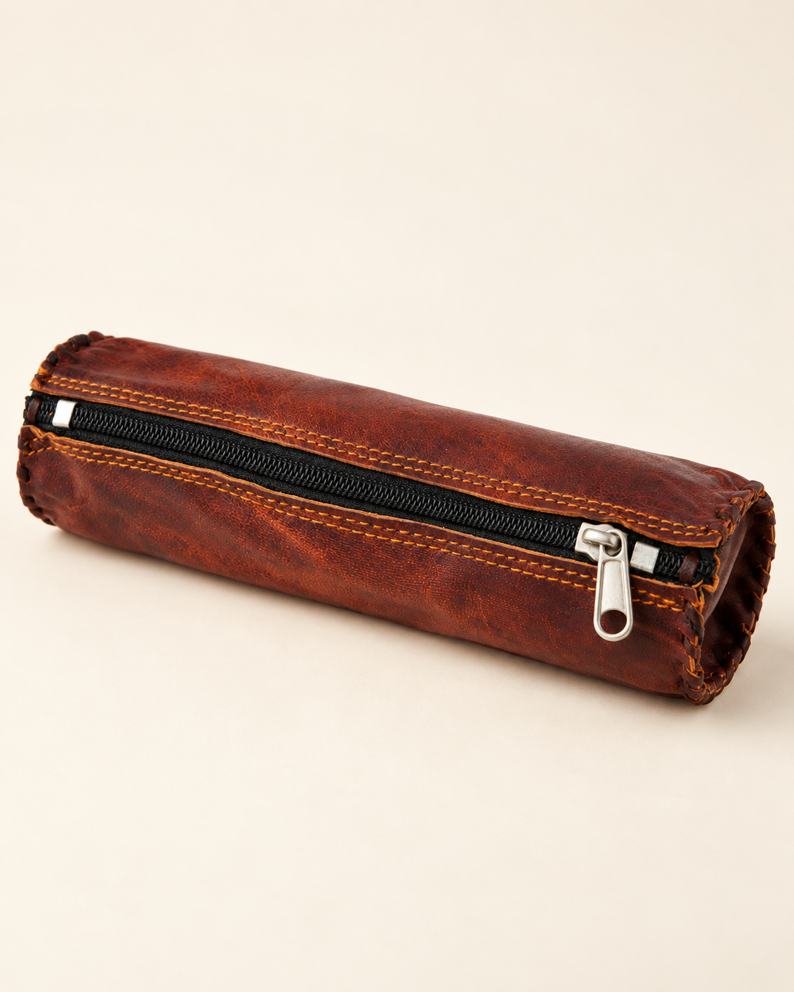 Handcrafted full-grain leather pencil case in natural brown angled view